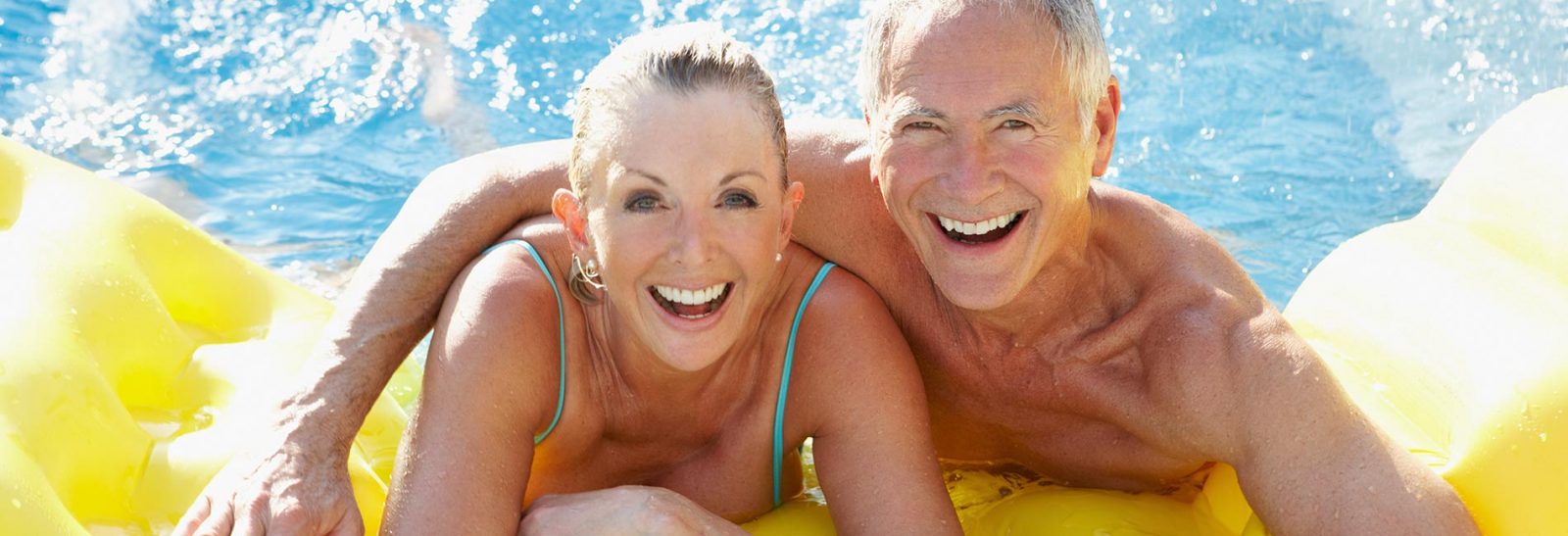 residents in pool smiling